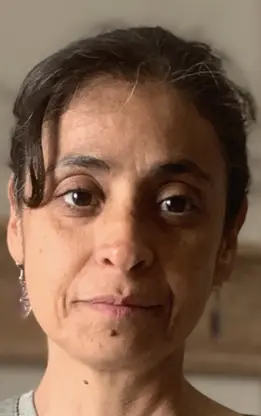 Luisa with her cat — she also works with animal companions